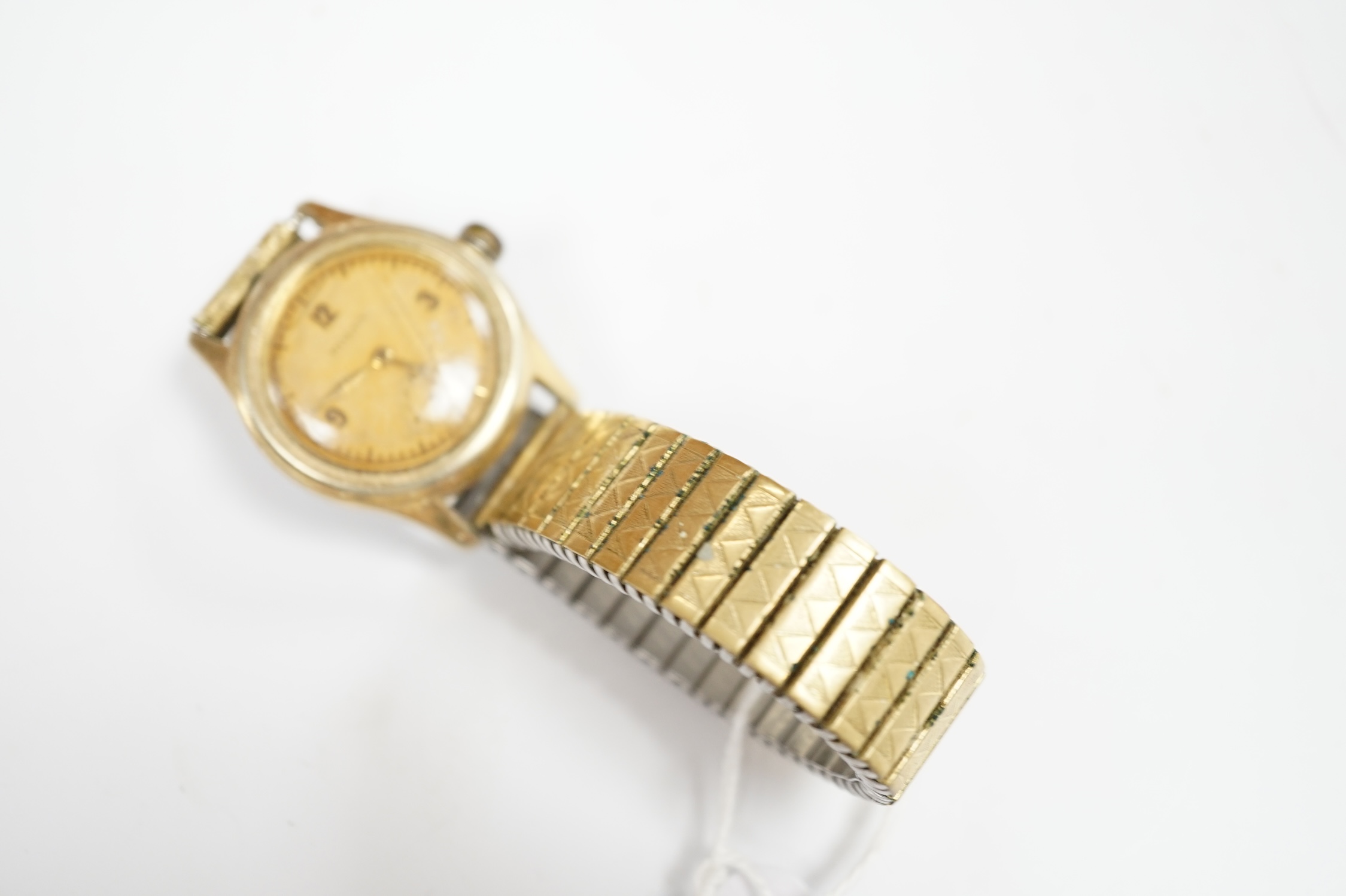 A gentleman's 1940's? mid-size steel and gold plated Rolex manual wind wrist watch, case diameter 30mm, on an associated flexible bracelet, with a Rolex box. Condition - poor